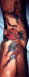 Roses and butterfly foot tattoo